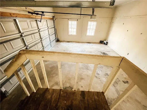 a view of a garage with wooden floor