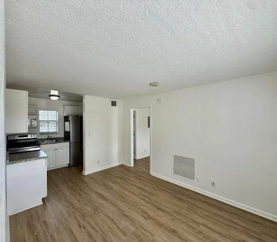 a view of a kitchen with a microwave and stove