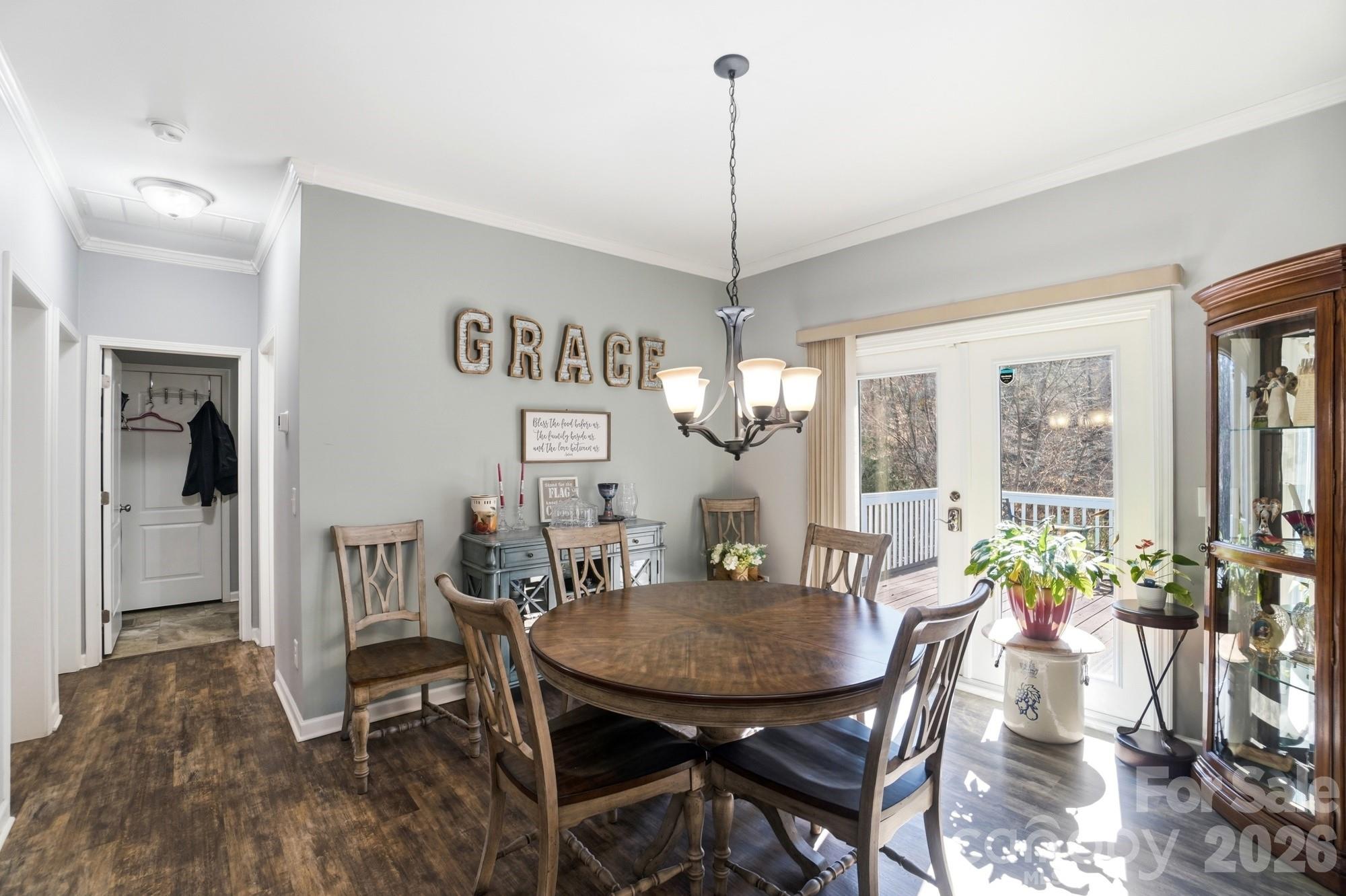 4363 Grace Church Road Newton, NC 28658 - Photo 13 of 30 a view of a dining room with furniture window and wooden floor