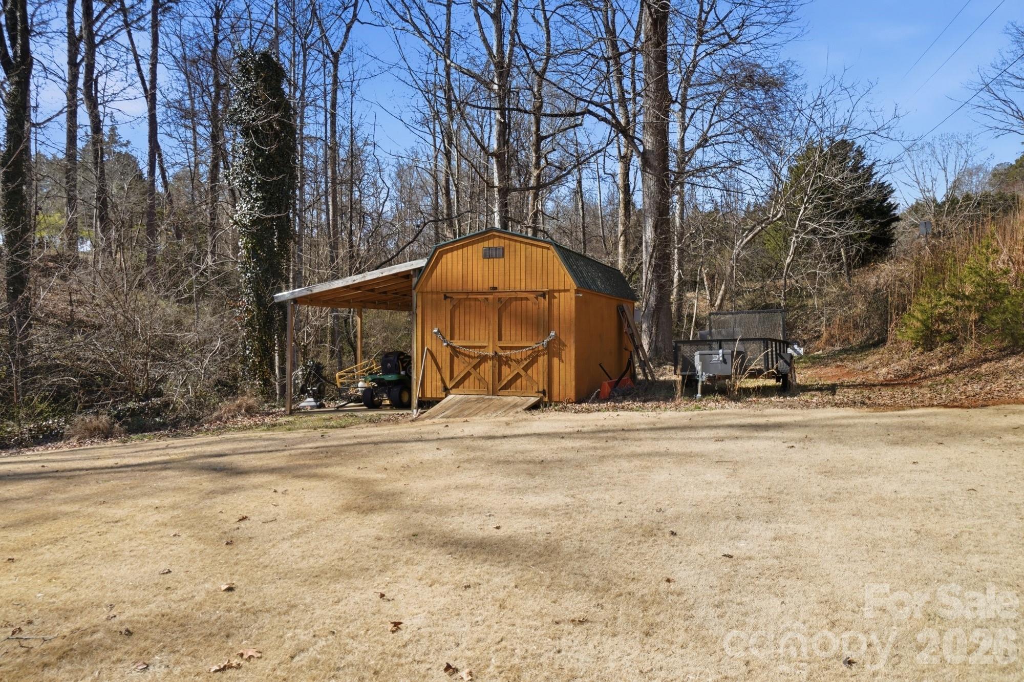 4363 Grace Church Road Newton, NC 28658 - Photo 30 of 30 a view of a yard with a trees