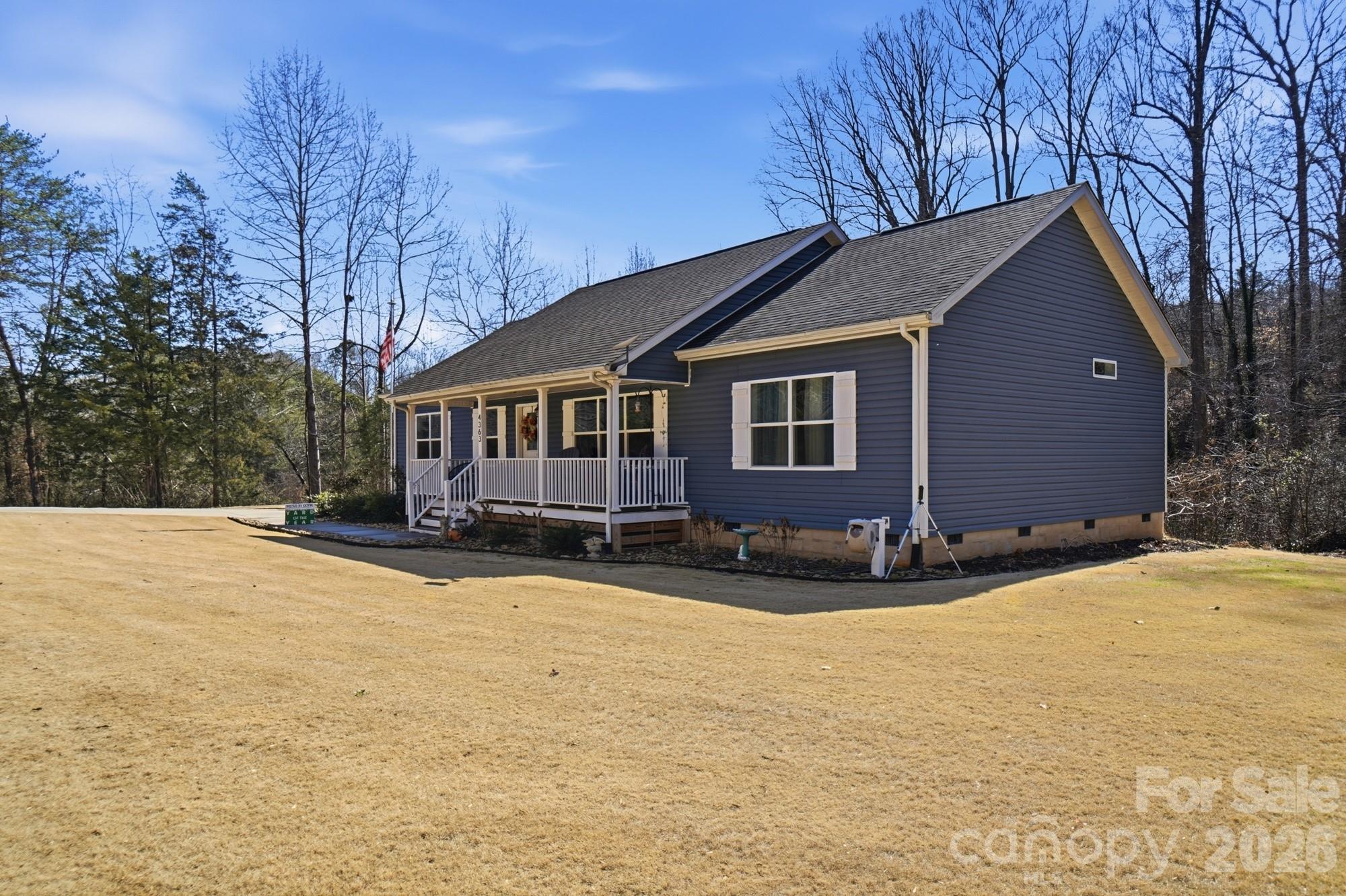4363 Grace Church Road Newton, NC 28658 - Photo 3 of 30 a front view of a house with a yard covered in snow