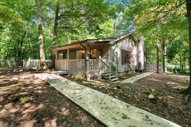 a house with trees in the background