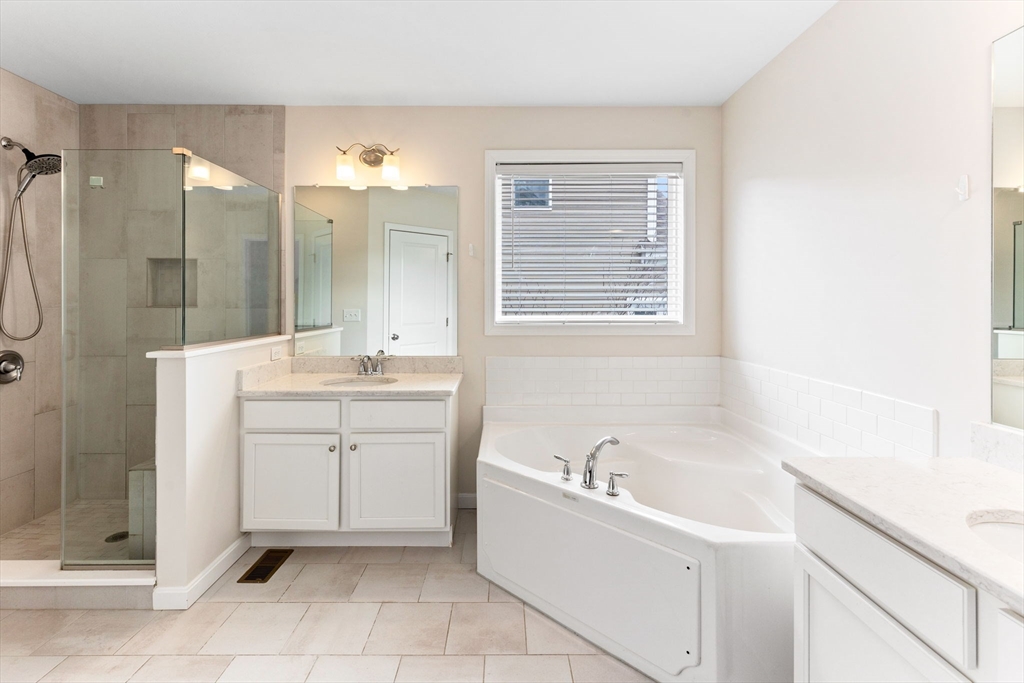 55 Oldfield Road Bridgewater, MA 02324 - Photo 11 of 35 a bathroom with a bathtub sink and mirror