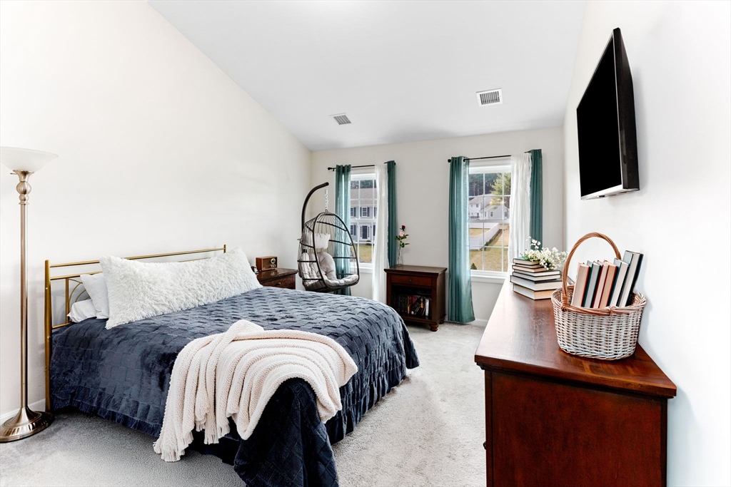 55 Oldfield Road Bridgewater, MA 02324 - Photo 24 of 35 a bedroom with a bed chair and flat screen tv