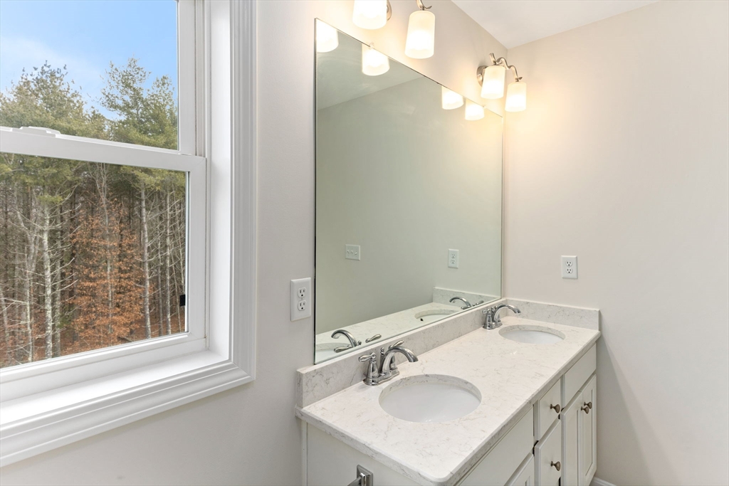 55 Oldfield Road Bridgewater, MA 02324 - Photo 27 of 35 a bathroom with a sink and a mirror