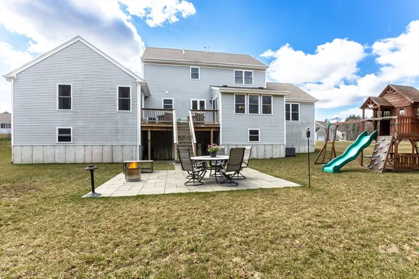 a view of a house with swimming pool and sitting area