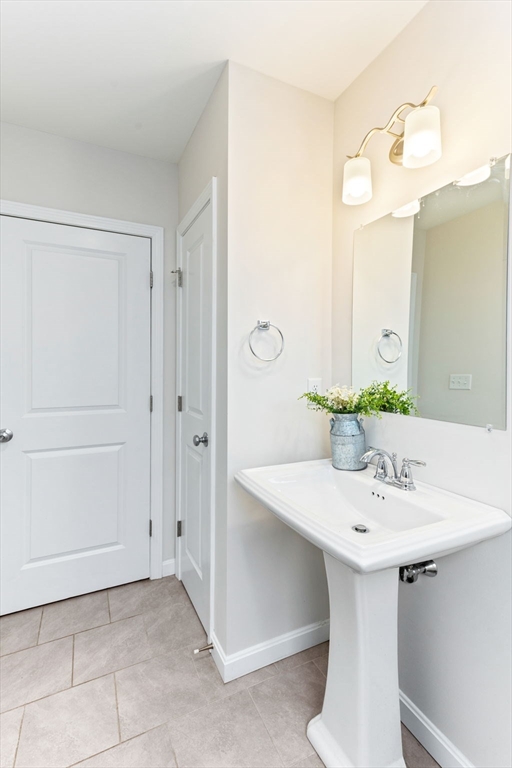 55 Oldfield Road Bridgewater, MA 02324 - Photo 6 of 35 a bathroom with a sink and a mirror