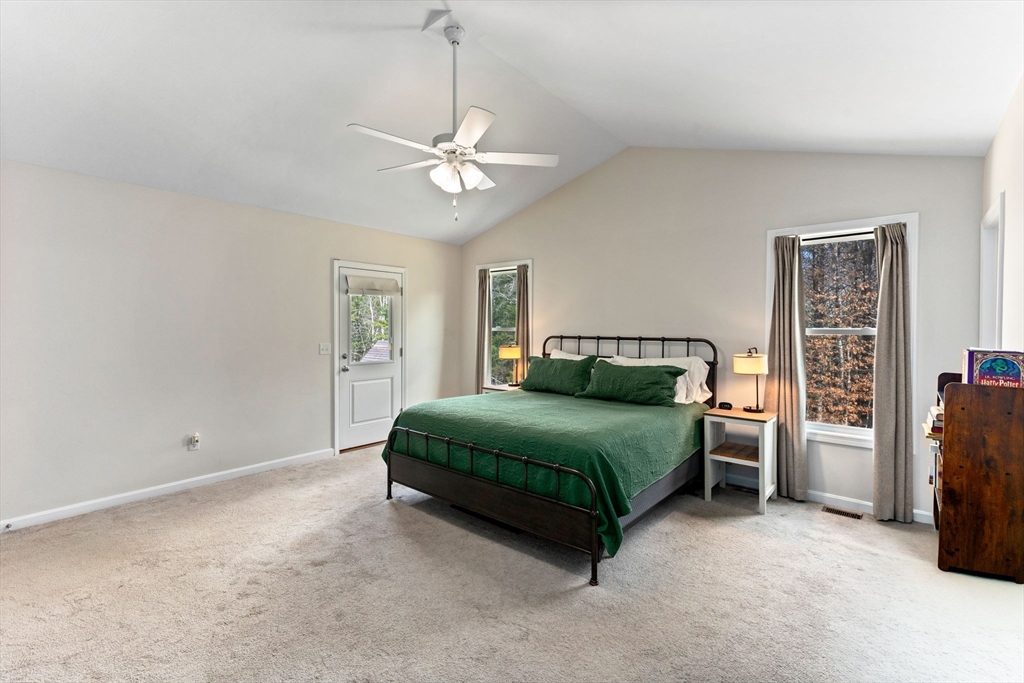 55 Oldfield Road Bridgewater, MA 02324 - Photo 9 of 35 a bedroom with a bed and a chandelier