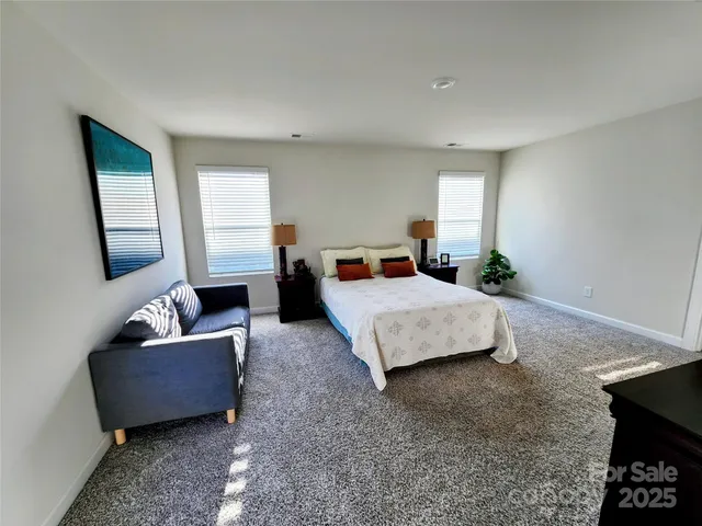 a bedroom with bed and window