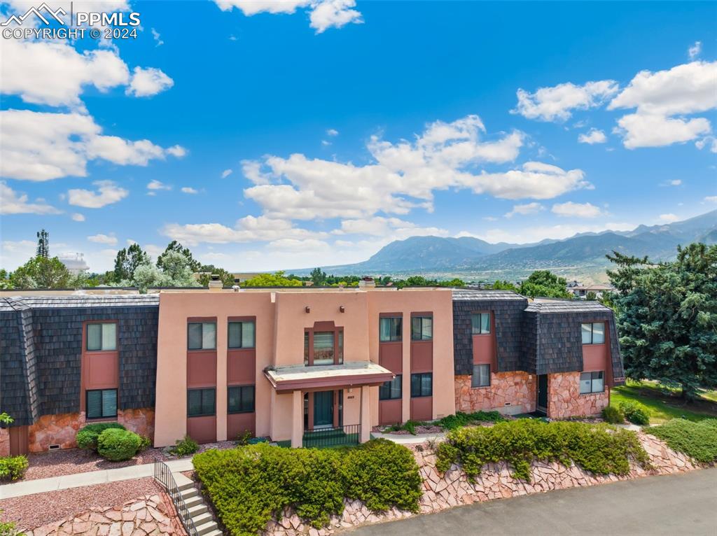 2927 Mesa Road, Unit C Colorado Springs, CO 80904 - Photo 1 of 34 front view of a house with a yard