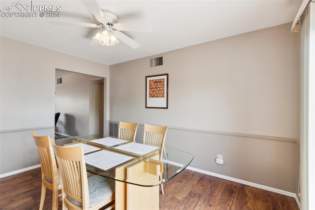 2927 Mesa Road, Unit C Colorado Springs, CO 80904 - Photo 13 of 34 a view of a dining room with furniture and a chandelier fan