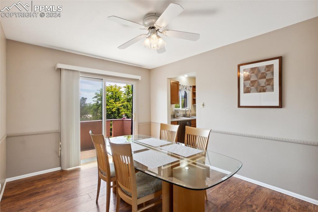 2927 Mesa Road, Unit C Colorado Springs, CO 80904 - Photo 15 of 34 a view of a dining room with furniture window and wooden floor