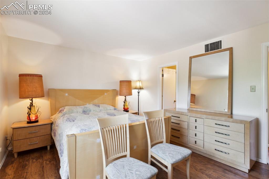 2927 Mesa Road, Unit C Colorado Springs, CO 80904 - Photo 17 of 34 a bedroom with a bed a couch and dresser