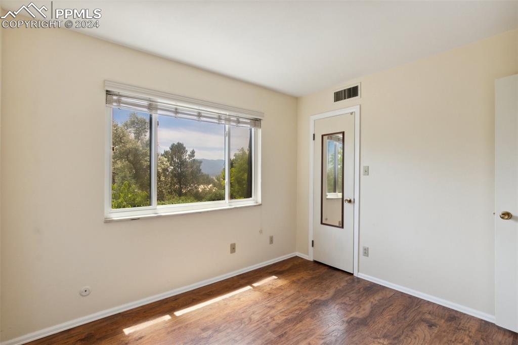 2927 Mesa Road, Unit C Colorado Springs, CO 80904 - Photo 23 of 34 an empty room with a window
