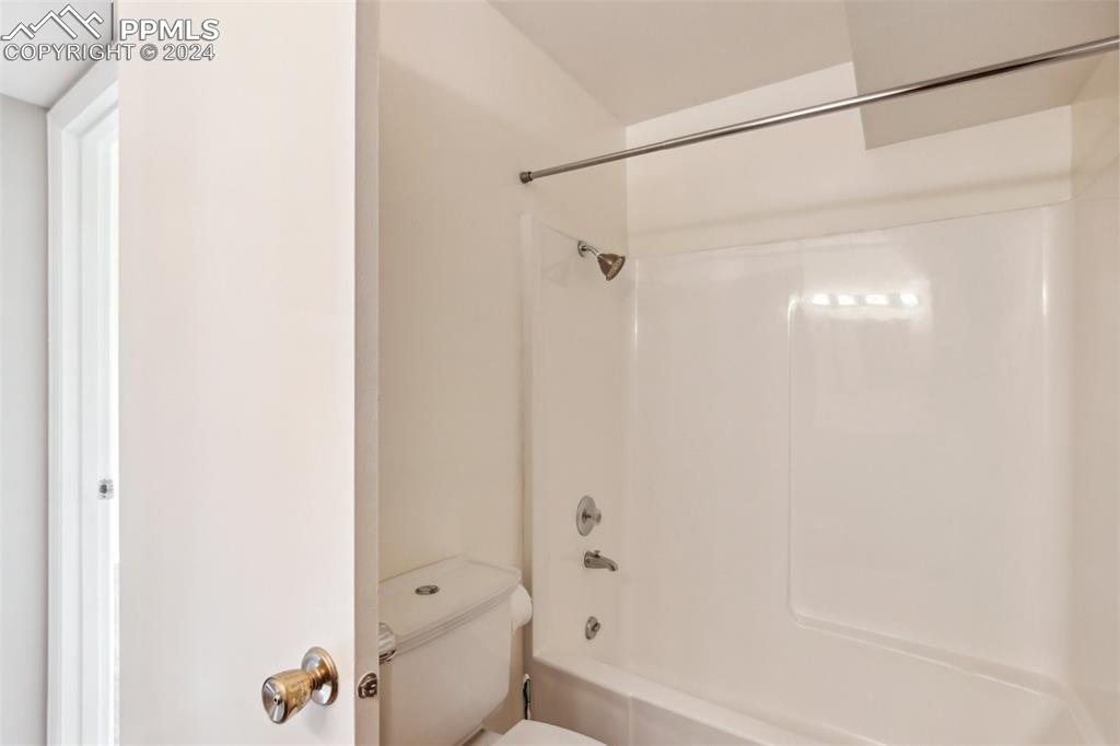 2927 Mesa Road, Unit C Colorado Springs, CO 80904 - Photo 27 of 34 a bathroom with a shower and a toilet