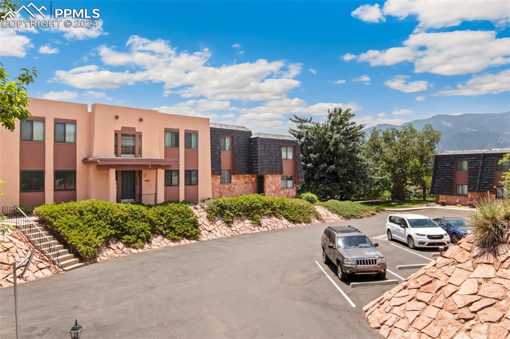 2927 Mesa Road, Unit C Colorado Springs, CO 80904 - Photo 31 of 34 a view of a lounge chairs in front of a building