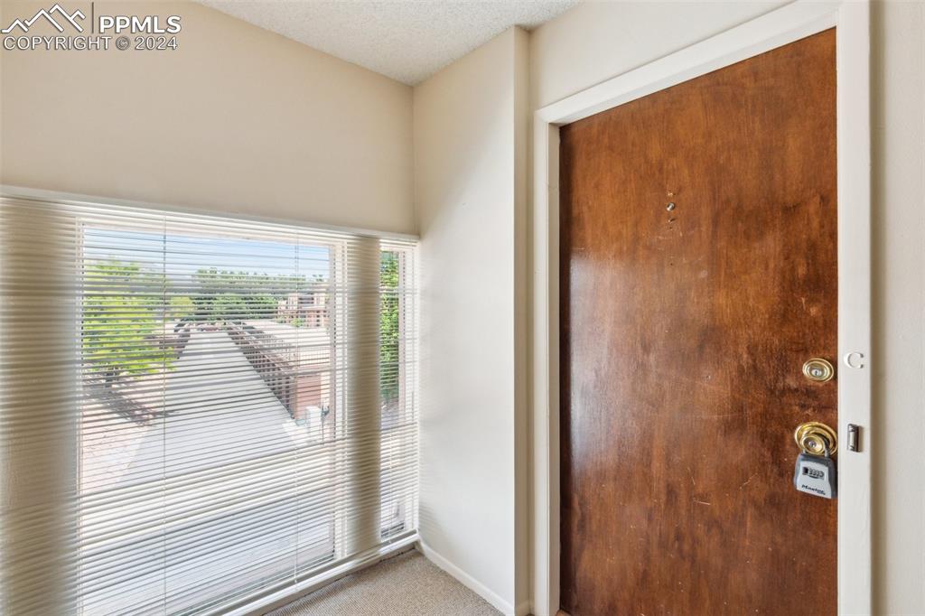 2927 Mesa Road, Unit C Colorado Springs, CO 80904 - Photo 5 of 34 a view of a glass door with a glass door