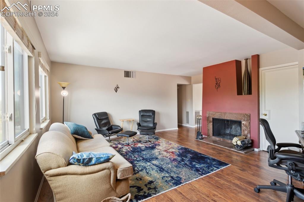 2927 Mesa Road, Unit C Colorado Springs, CO 80904 - Photo 6 of 34 a living room with furniture and a fireplace