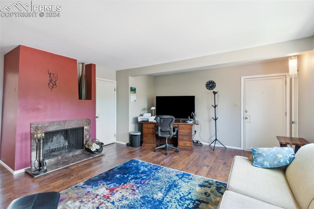 2927 Mesa Road, Unit C Colorado Springs, CO 80904 - Photo 9 of 34 a living room with furniture and a fireplace