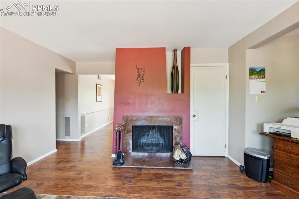 2927 Mesa Road, Unit C Colorado Springs, CO 80904 - Photo 10 of 34 a living room with furniture and a fireplace