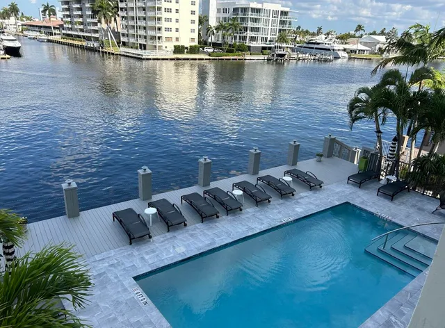 a view of a lake with outdoor seating