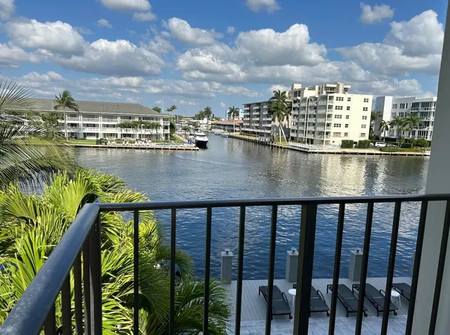 a view of swimming pool from a balcony