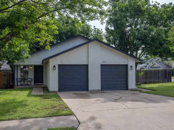 a front view of house with a yard