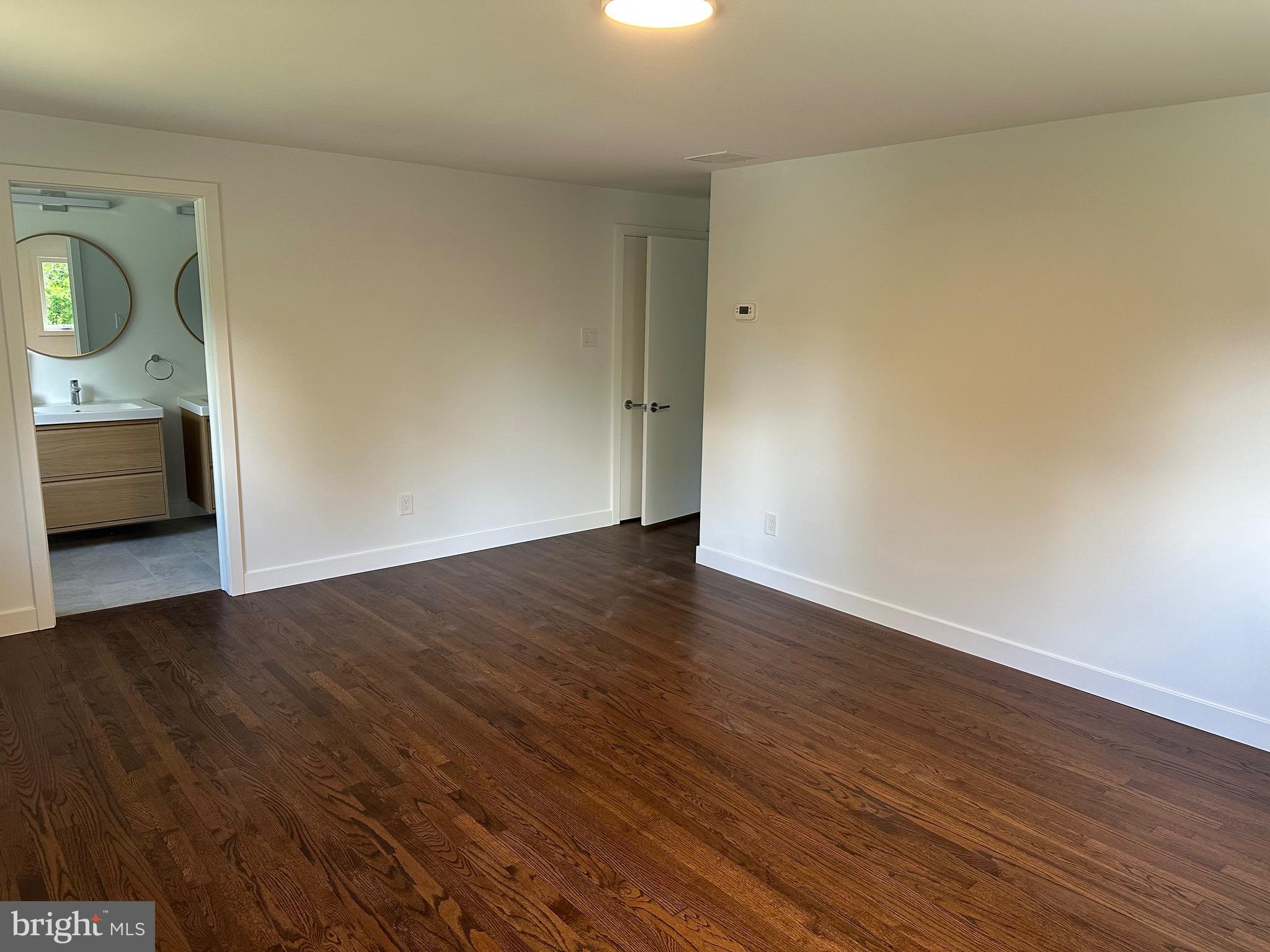 713 Woodfield Road Villanova, PA 19085 - Photo 15 of 36 a view of an empty room and wooden floor