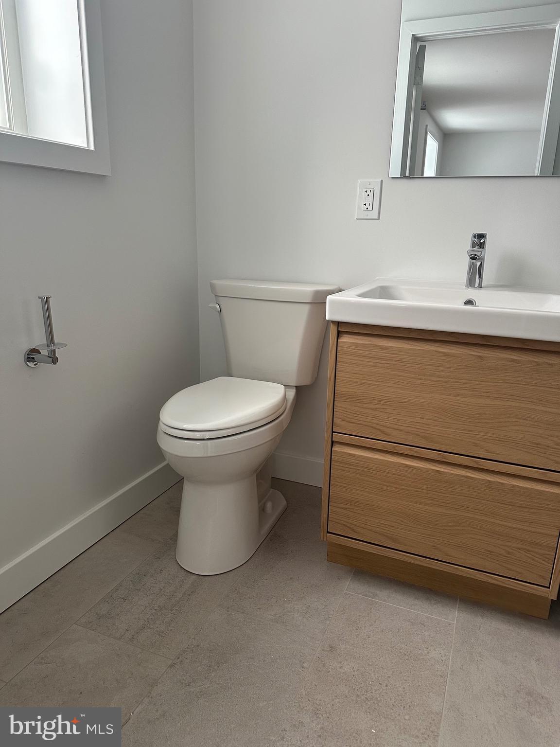 713 Woodfield Road Villanova, PA 19085 - Photo 18 of 36 a bathroom with a sink toilet and mirror