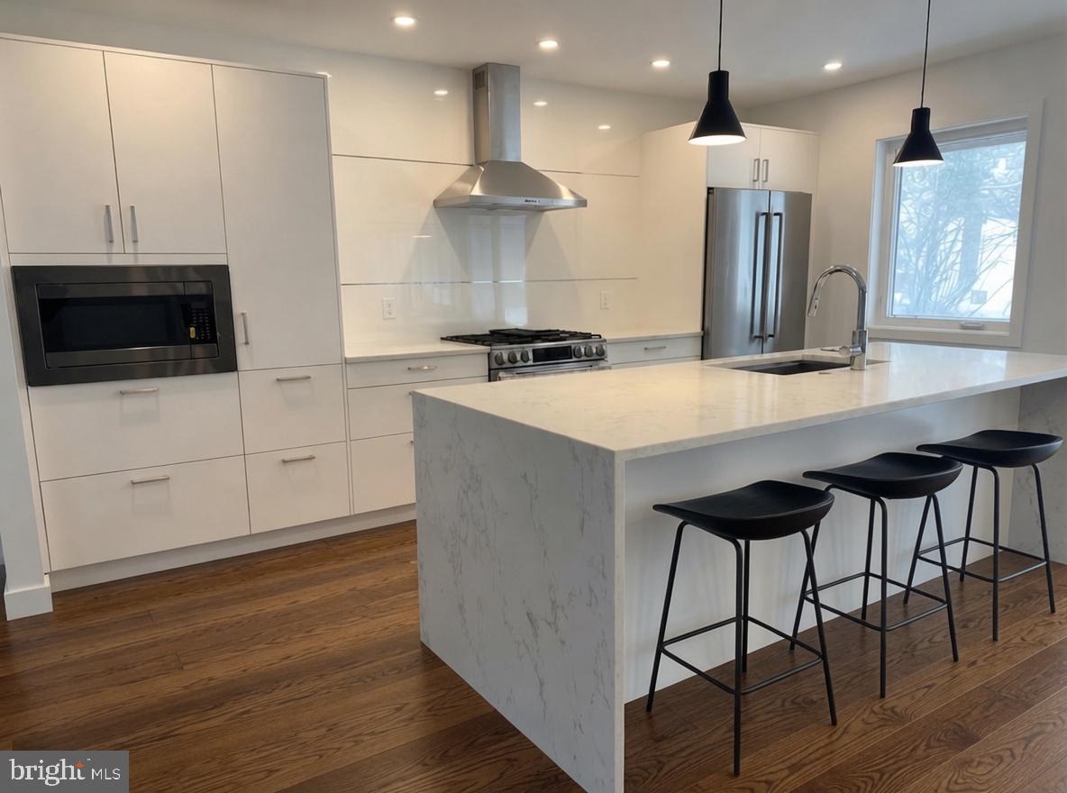 713 Woodfield Road Villanova, PA 19085 - Photo 4 of 36 a large kitchen with a table and chairs