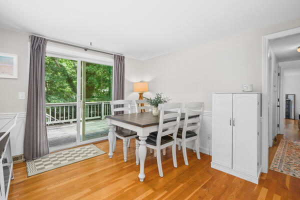 882 West Yarmouth Road Yarmouth Port, MA 02675 - Photo 12 of 36 a view of a dining room with furniture wooden floor and next to a window