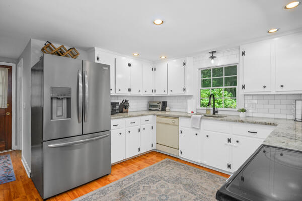 882 West Yarmouth Road Yarmouth Port, MA 02675 - Photo 14 of 36 a kitchen with granite countertop stainless steel appliances a refrigerator sink and cabinets