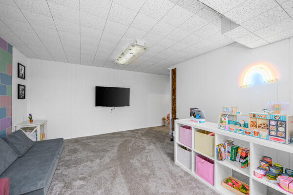 882 West Yarmouth Road Yarmouth Port, MA 02675 - Photo 27 of 36 a room with furniture and a flat screen tv