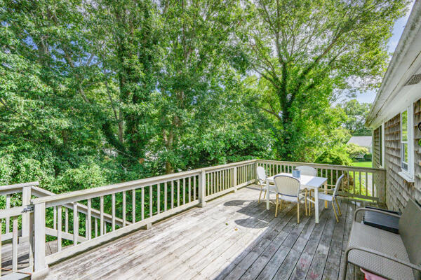 882 West Yarmouth Road Yarmouth Port, MA 02675 - Photo 31 of 36 a view of a chairs and table on the wooden deck