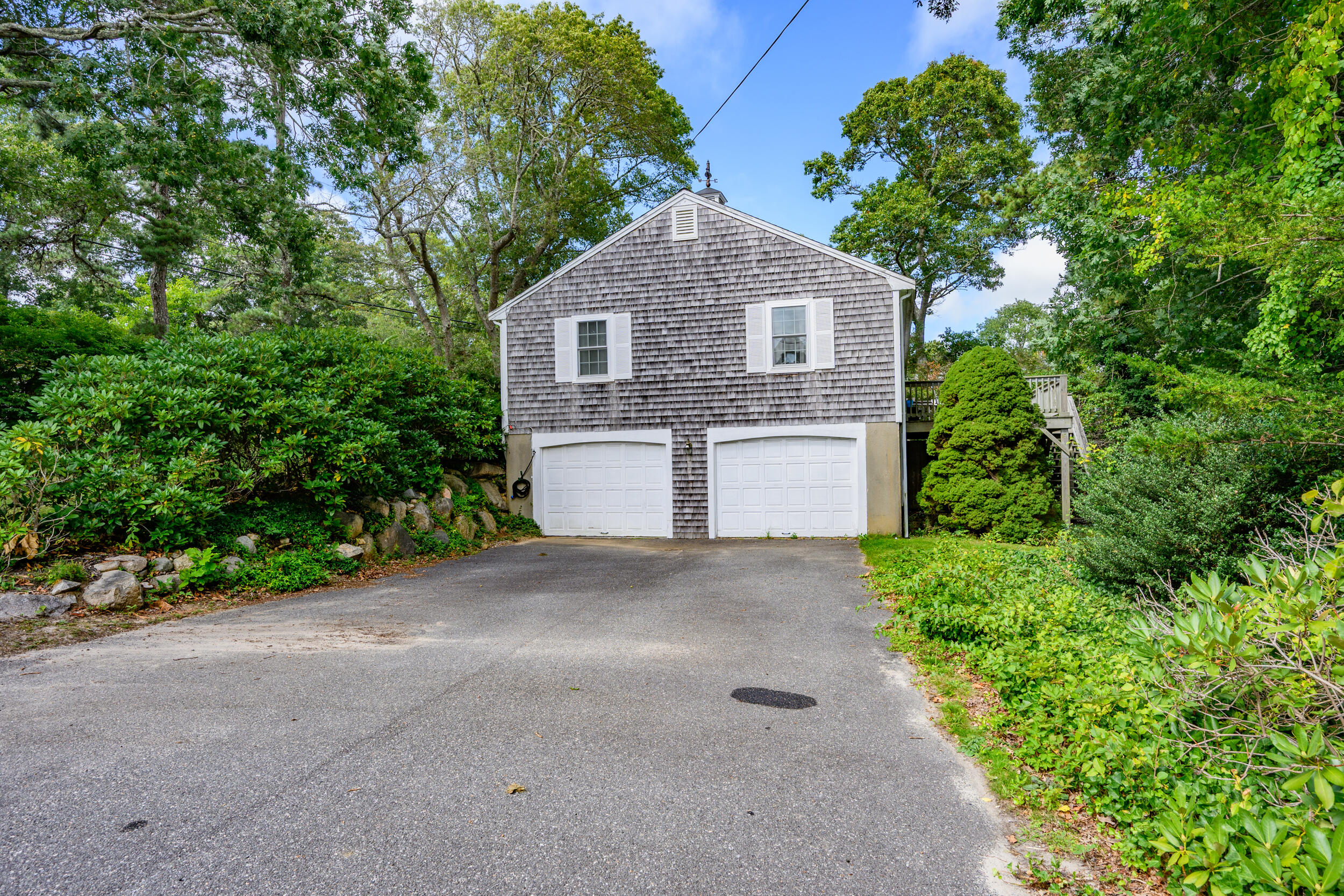 882 West Yarmouth Road Yarmouth Port, MA 02675 - Photo 36 of 36 a front view of a house with a yard and garage