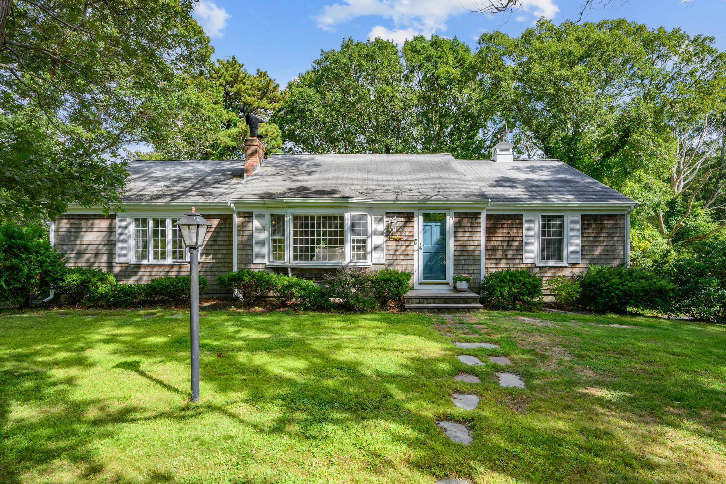 882 West Yarmouth Road Yarmouth Port, MA 02675 - Photo 5 of 36 a front view of a house with a yard