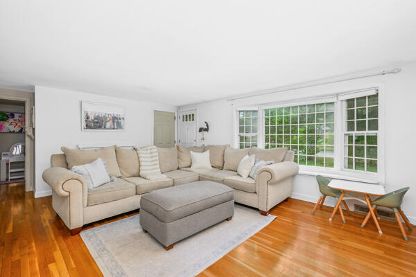 882 West Yarmouth Road Yarmouth Port, MA 02675 - Photo 9 of 36 a living room with furniture and a large window