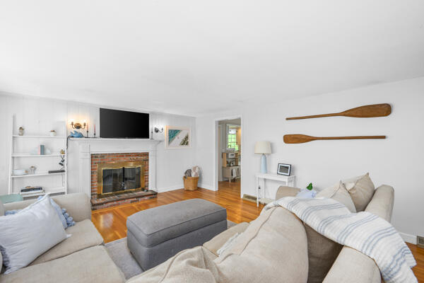 882 West Yarmouth Road Yarmouth Port, MA 02675 - Photo 10 of 36 a living room with furniture and a fireplace