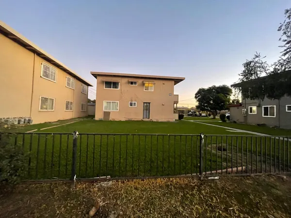 a view of a house with a big yard