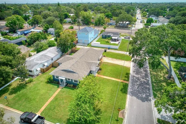 an aerial view of a house with a garden