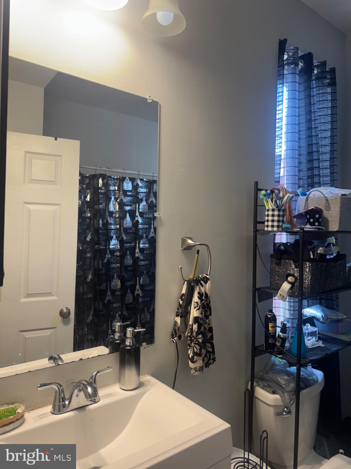 537 South Duke Street York, PA 17401 - Photo 12 of 17 a bathroom with a sink and a mirror