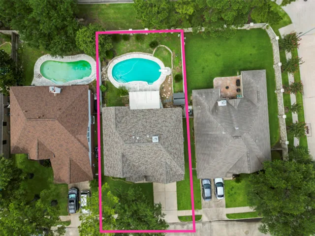 a view of a house with pool and chairs