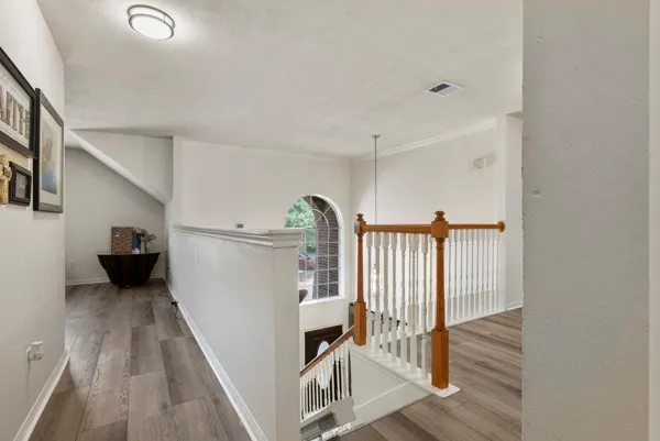 a view of a hallway with windows