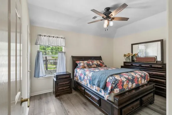 a bedroom with a bed and a dresser