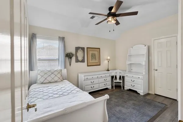 a bathroom with a double vanity sink toilet mirror and bathtub