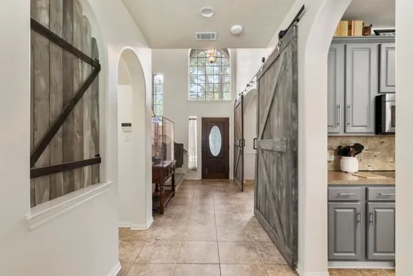 a spacious bathroom with a bathtub and a shower