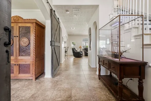 a view of hallway with living room and furniture