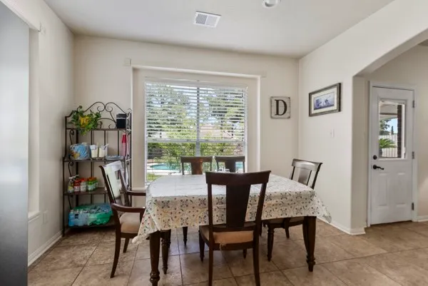 a kitchen with stainless steel appliances granite countertop a refrigerator and a stove