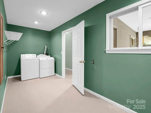 an empty room with a window and a projector