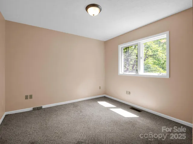 a white toilet sitting next to a bath tub